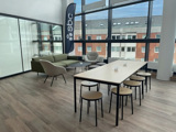Konferensbord och soffa på SBCs kontor i Malmö